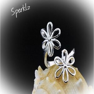 Cute silver plated openwork flower ring